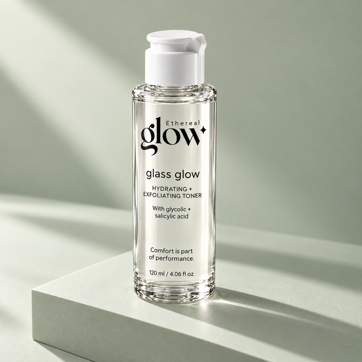 Ethereal glow Glass Glow 120 ml toner packaging concept on a pale sage studio block, showing the bottle and cap.