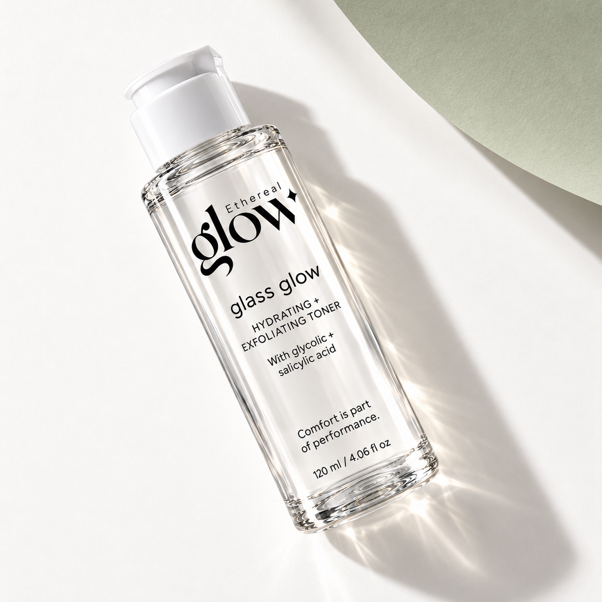 Overhead flat lay of the Glass Glow 120 ml toner packaging concept on a white and pale sage surface.